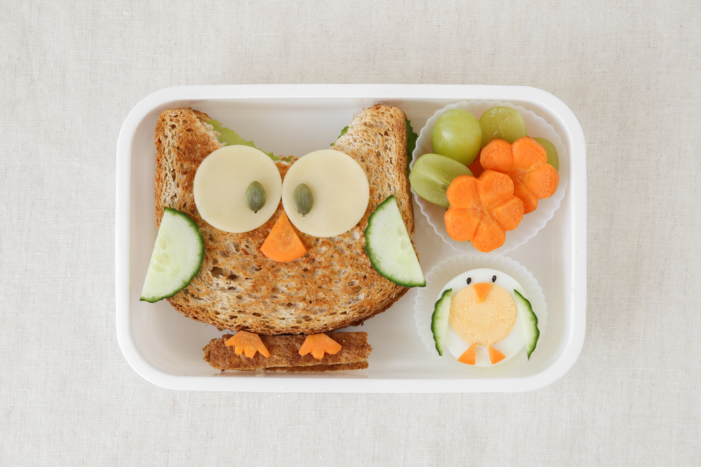 ©SewCreamStudio Back to school snack with toast, cheese, and vegetables