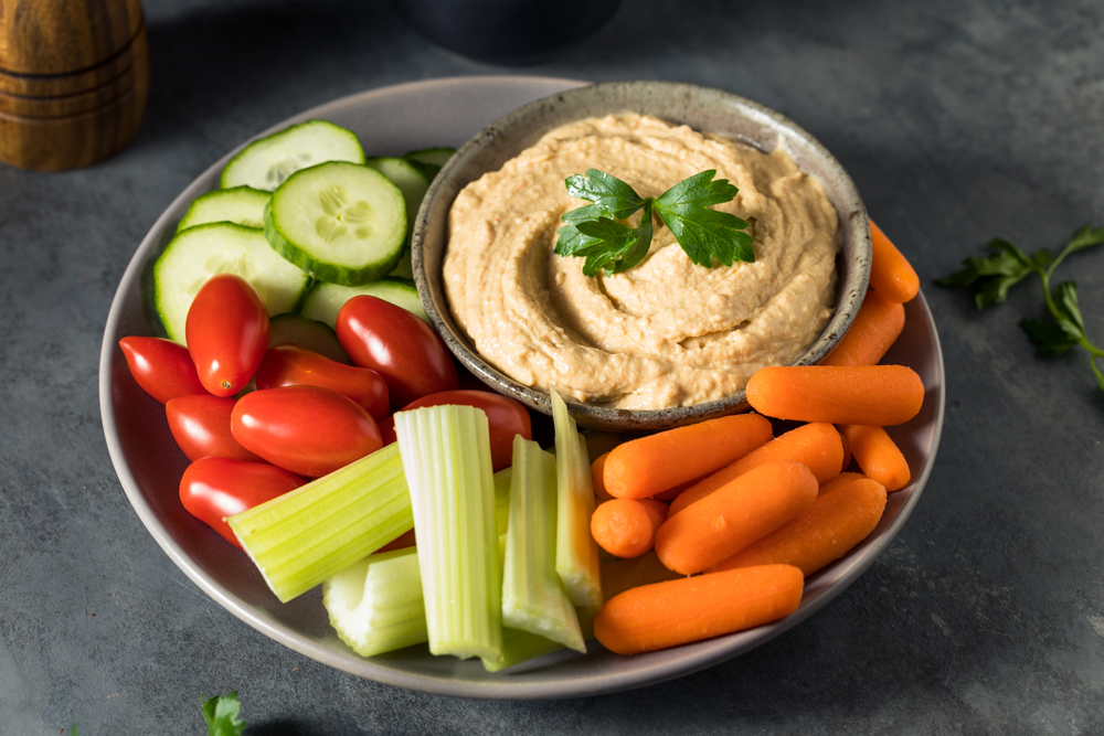 Healthy snack plate of veggies and hummus ©Brent Hofacker